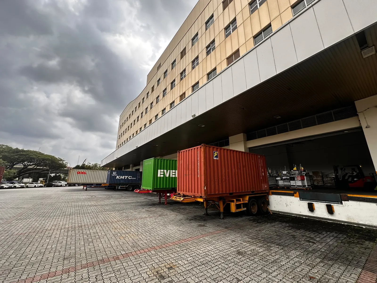 Shipping containers at Nexxcojaya's loading dock in Singapore